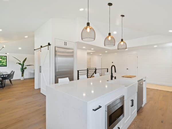 turned on pendant lamps above kitchen island