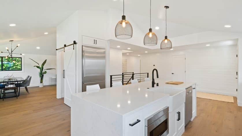 turned on pendant lamps above kitchen island